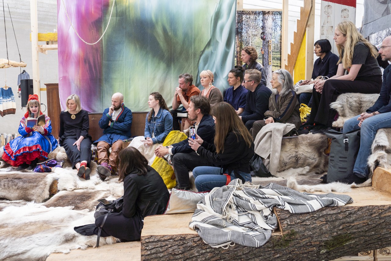  © Conversation on “Architecture in Sápmi”. Conversation on “Architecture in Sápmi” with Astrid Fadnes, Jenni Hakovirta, Grethe Johanna Minde, Joar Nango, Káre Raija Anti, Katrine Rugeldal, Eveliina Sarapää, Magnus Antaris Tuolja and Mary Ailonieida Sombán Mari (May 20, 2023). Part of “Girjegumpi: The Sámi Architecture Library” by Joar Nango and collaborators at the Nordic Countries Pavilion (18th International Architecture Exhibition – La Biennale di Venezia). Photo: Federico Sutera (2023). CC BY-SA 4.0