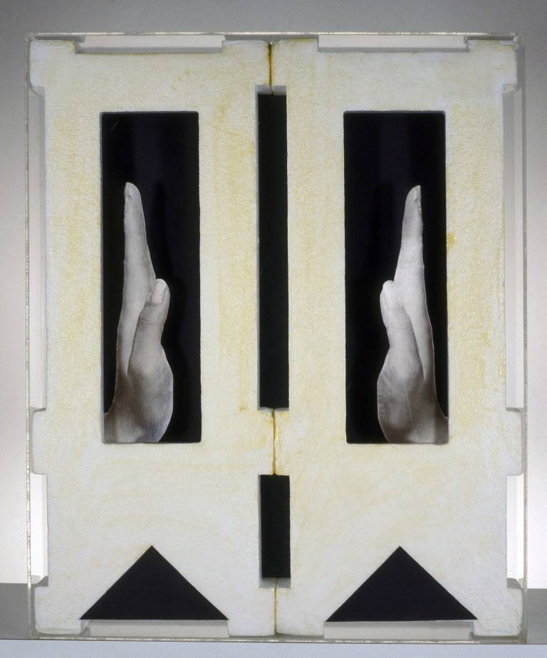 Tomaso Binga, Mani, 1973, polistirolo collage e plexiglass